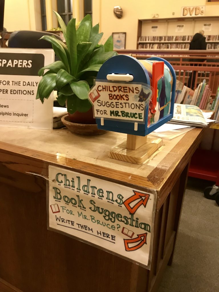 Small, colorful mailbox for suggestion cards for the children's book section