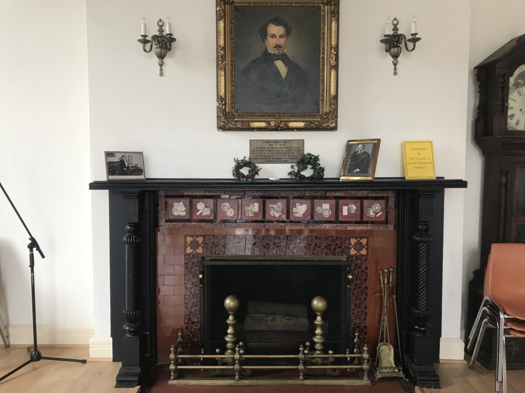 Tiled fireplace with brass fixtures